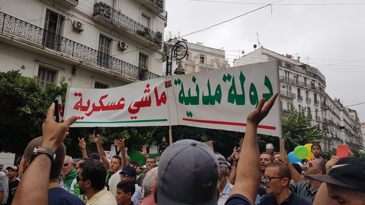 Algerian protesters on Friday with a banner demanding civilian rule