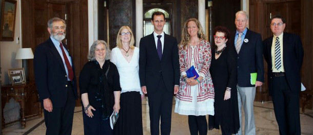Beeley (fourth from right) with President Assad in 2016. She described it as her proudest moment.