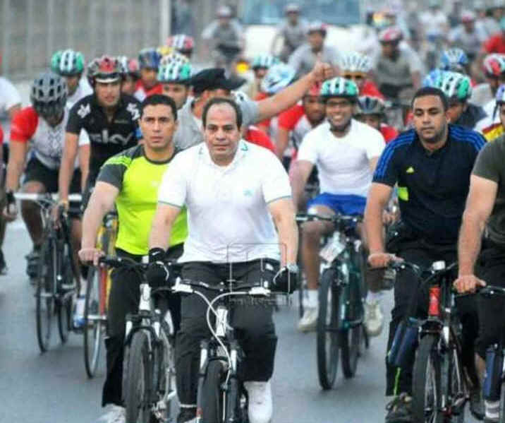 Saving on fuel, President Sisi takes to a bike