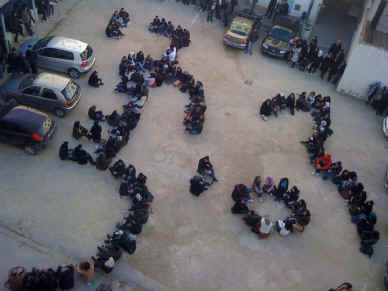Silenced no more: Students at an engineering institute in Tunis arranged themselves to spell out the words 
