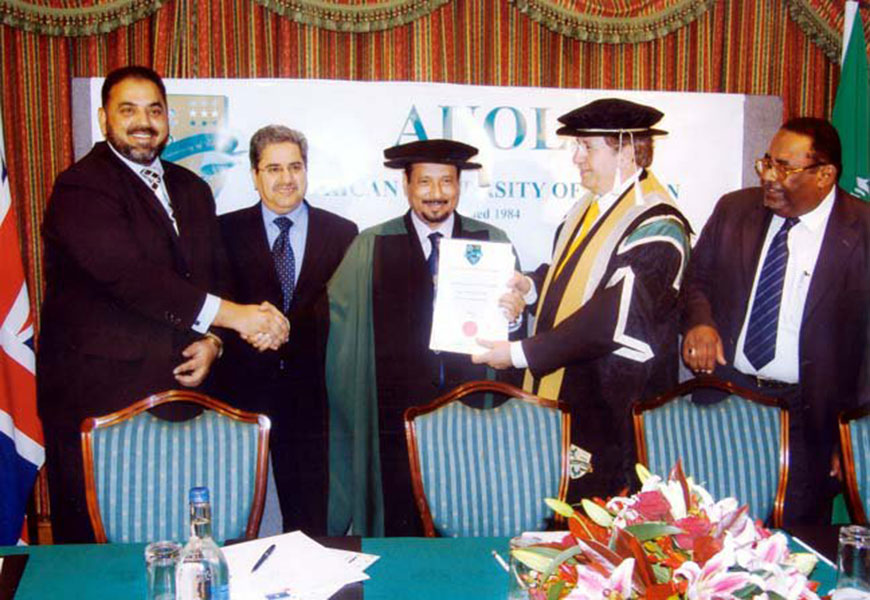 Billionaire Mohammed Aboud al-Amoudi receiving his certificate