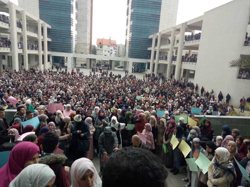 Students gathering at the university to pay respects on Monday