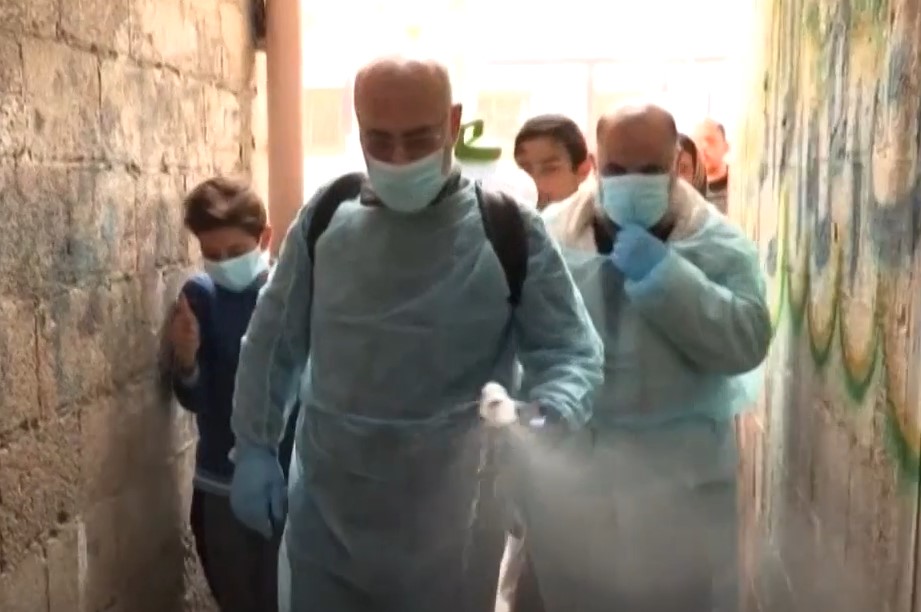 Disinfecting an alley in Gaza