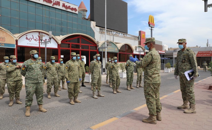 Troops from the National Guard line up at al-Nuzha supermarket
