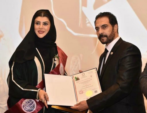 Princess Doaa receiving her certificate in Sharjah